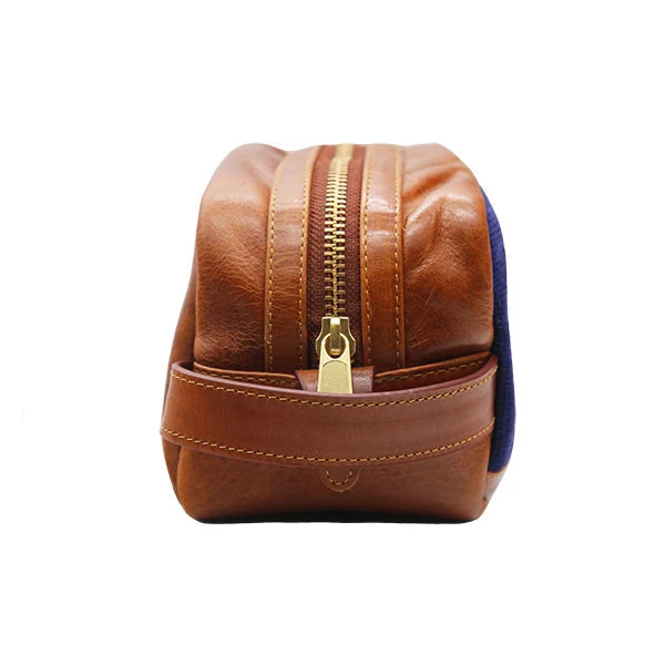 Hand-stitched leather Smathers & Branson Toiletry Bag with a gold zipper, shown from the side against a white background. This elegant accessory showcases the timeless craftsmanship characteristic of Smathers & Branson designs.