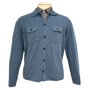 The Alan Paine Tore Cardigan with Pockets, shown on a mannequin over a checkered collared shirt, is a versatile blue layering piece featuring two breast pockets.