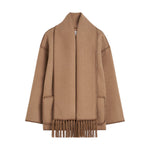 The Toteme Embroidered Scarf Jacket is a camel wool-blend coat with front patch pockets and a fringed, attached scarf, crafted according to the Responsible Wool Standard.