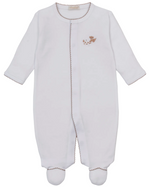 The Kissy Kissy Baby Premier Puppy Paws Hand Emb. Footie is a white long-sleeve onesie from the Puppy Paws Collection, made with soft Peruvian cotton and detailed with brown stitching and a small brown embroidered bear on the chest.