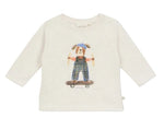 The Arsene & Les Pipelettes Baby Boys’ Skating Dog T-Shirt is a long-sleeve white cotton tee featuring a printed illustration of a dog in overalls and a blue hat, riding a skateboard.