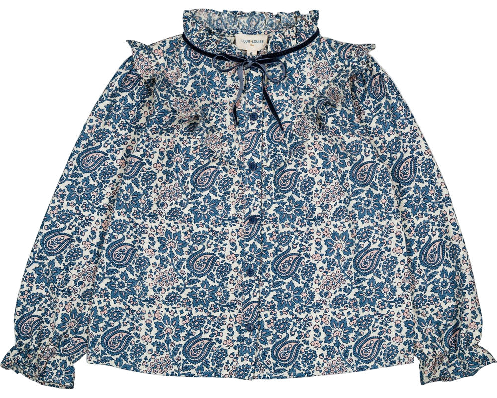 The Girls' Imani Twill Cashmere Tunic by Louis Louise features long sleeves, printed blue paisley and floral designs, a ruffled collar, front tie, and elasticized cuffs.