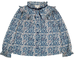 The Girls' Imani Twill Cashmere Tunic by Louis Louise features long sleeves, printed blue paisley and floral designs, a ruffled collar, front tie, and elasticized cuffs.