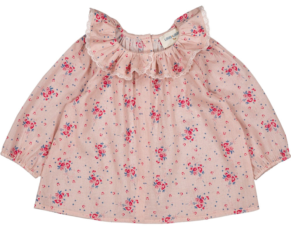 The Louis Louise Baby Girls' Lissou Cotton Veil Romantic Flower Tunic features long sleeves, pink floral print, a ruffled Peter Pan collar with lace trim, and back button closure.