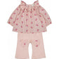 The Louis Louise Baby Girls' Lissou Cotton Veil Romantic Flower Tunic features a pink floral design with long sleeves and a ruffled lace collar, styled with light pink pants accented by heart-shaped knee patches.