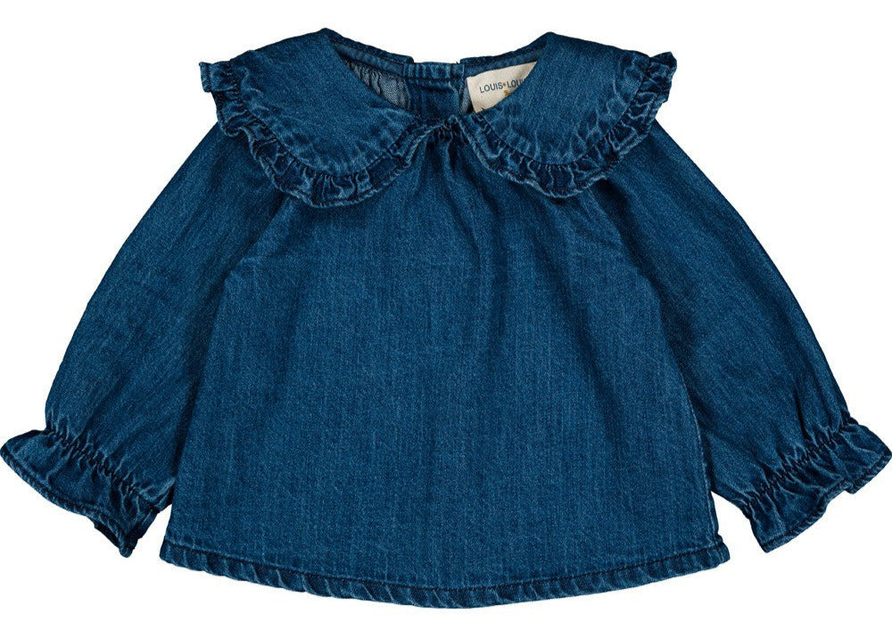 The Louis Louise Baby Girls' Yvette Light Denim Tunic features long sleeves, a ruffled Peter Pan collar, and ruffled cuffs.