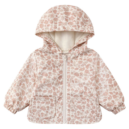 The Quincy Mae Baby and Kids’ Rain Coat is a light-colored toddler raincoat with a pink floral pattern, hood, front zipper, two pockets, airflow flap for breathability, and elastic cuffs, displayed on a plain white background.