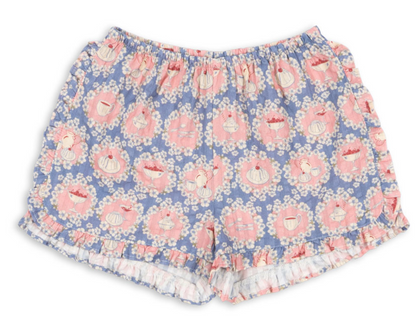 Introducing the Baby Girls’ and Girls’ Kim Frill Shorts by Konges Slojd—crafted from soft organic cotton, these blue and pink floral pajama shorts feature charming tea cup, teapot, and wreath prints. The elastic waist and ruffled hem add whimsical charm and comfort for delightful lounging.