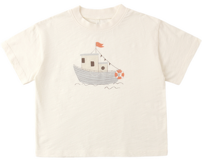 The Rylee & Cru Baby Boys' and Boys' Relaxed Tee is a cream short-sleeve cotton jersey, featuring a simple boat with red flag and lifebuoy illustration, designed for easy dressing and all-day comfort.