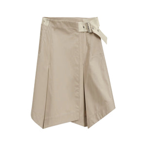 The 3.1 Phillip Lim Two-Toned Handkerchief Wrap Skirt features an architectural hemline, front pleats, and a side buckle belt detail, shown on a white background.