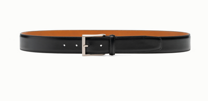 The Magnanni Viento Belt in black calfskin leather with a silver buckle is showcased against a white background.