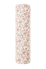 The Quincy Mae Bamboo Swaddle features soft bamboo fabric with a white background and a pink and orange floral pattern.