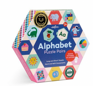 Here is a revised version of your sentence using the provided product data: The Eeboo Alphabet Hexagon Pairing Puzzles come in a hexagonal box adorned with illustrated letters and animals. Ideal for skill-building activities, this set helps children ages 3 and up learn to read by matching pictures to letters. The packaging displays the message “Match Pictures to Letters” along with an award badge.