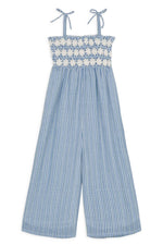 The Louise Misha Baby Girls' and Girls' Morli Overalls feature a blue and white striped pattern in cotton voile, with a smocked bodice and adjustable shoulder ties for an ideal fit.