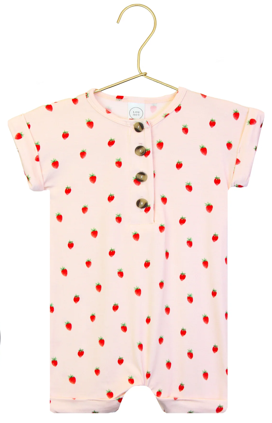 A pink Baby Girls’ Junie Romper one-piece by Lou Lou & Company for babies, featuring short sleeves, wooden buttons, and a small red strawberry pattern, displayed on a gold hanger against a white background.