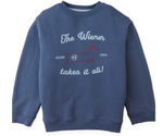 The Boys’ Riccardo Pullover by Gingersnaps is a blue fleece sweatshirt, detailed with a snug and stylish red embroidered outline of a dachshund and the phrase “The Wiener takes it all! since 1994” on the front.