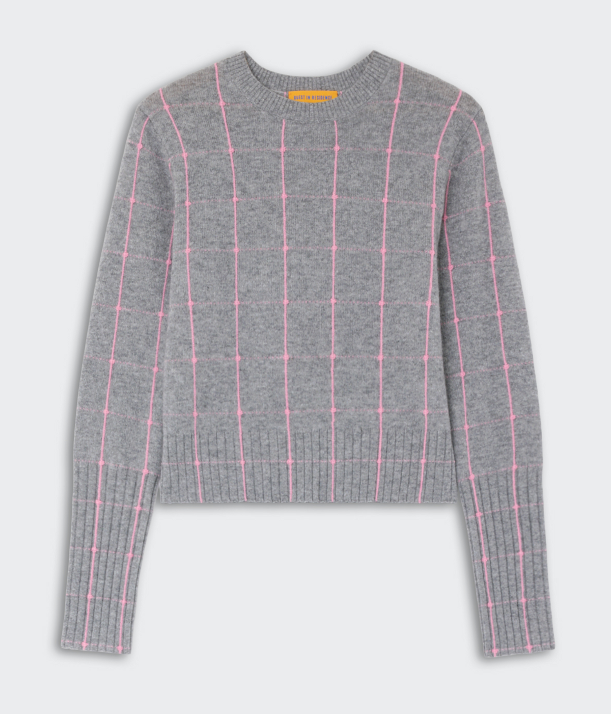 The Shrunken Checker Crew by Guest in Residence is a gray cashmere sweater with long sleeves and pink grid lines for a chic look.