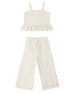 The Rylee & Cru Girls' Kayli Set features a cream-colored two-piece with a sleeveless ruffled crop top and wide-leg pants, both with embroidered eyelet details—ideal for warm weather.