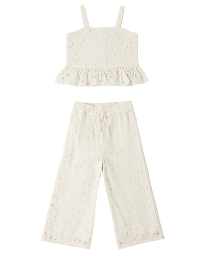 The Rylee & Cru Girls' Kayli Set features a cream-colored two-piece with a sleeveless ruffled crop top and wide-leg pants, both with embroidered eyelet details—ideal for warm weather.