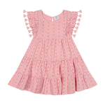 The Girls’ Sophie Tassel Dress by Mer is a pink, short-sleeved dress for girls made from lightweight cotton, featuring tiered layers with eyelet details and flutter sleeves accented by playful tassels, shown laid flat on a white background.