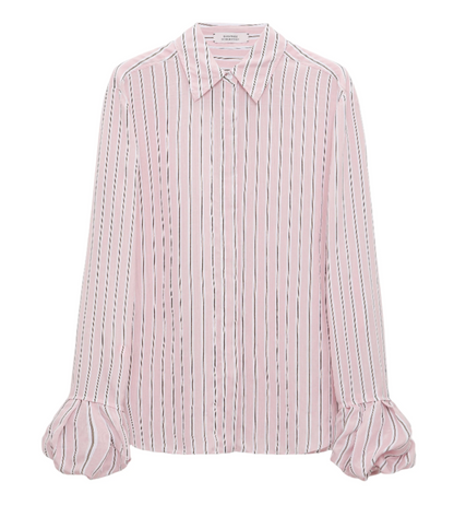 The Striped Ease Blouse by Dorothee Schumacher is a long-sleeve button-up in pink and white organdy voile, featuring vertical stripes, flared cuffs, and a pointed collar.