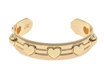 The Jane Win Love Set in Stone Heart Cuff features raised heart motifs and parallel line detailing, inspired by Jane Win coins, with an engraved "JW" on the inner side.