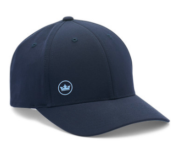 The Peter Millar Off Set Crown Seal Performance Hat is navy blue with a small light blue crown logo on the front left panel and made from lightweight, moisture-wicking fabric for comfort.