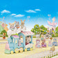 Calico Critters animal figures enjoy a fun-filled day outdoors as they ride the Floating Cloud Rainbow Train, surrounded by sparkling fireworks and other adorable animal friends in a whimsical amusement park scene.