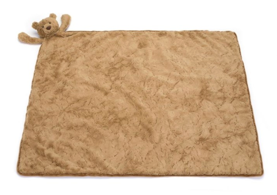 The Jellycat Bartholomew Bear Blankie is a rectangular, light brown plush blanket with a teddy bear head on one corner, made from recycled fibres.