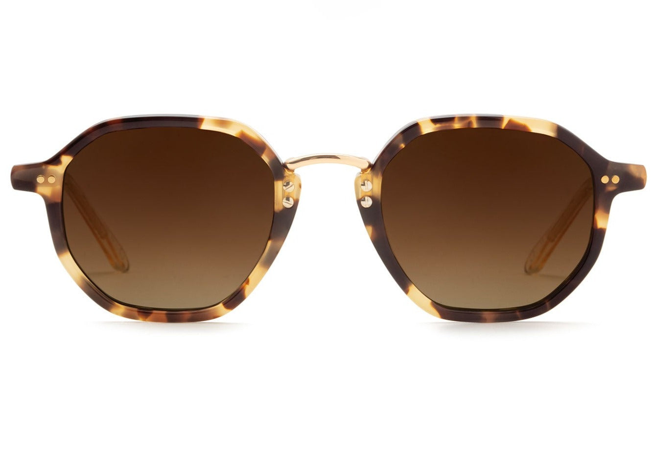 Krewe Dakota Sunglasses in Iberia + Haze Polarized offer brown tortoiseshell frames with round, polarized lenses and a subtle gradient tint. The handcrafted design adds elegance, and the adjustable temple wire guarantees a perfect fit.