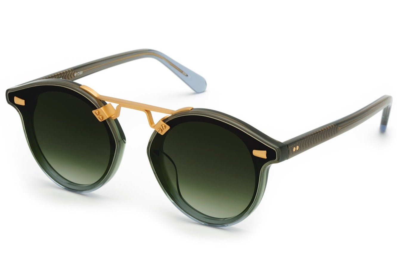 Krewe's STL Nylon Sunglasses are a luxurious pair of acetate eyewear that feature round, polarized nylon lenses and a gold bridge, highlighted by stylish brown and gray frames.