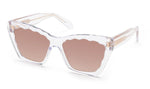 Krewe Brigitte Sunglasses by Krewe are clear-framed luxury eyewear with pink-tinted lenses, a scalloped edge design, and a chic cat-eye silhouette, offering full UVA/UVB protection.