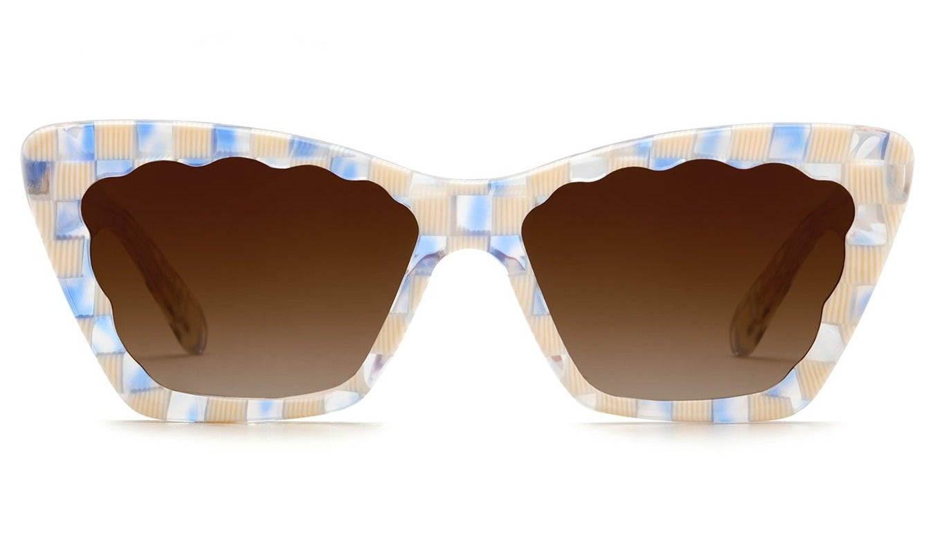 The Krewe Brigitte Sunglasses by Krewe feature a stylish cat-eye design with a multicolored checkered frame in light blue, beige, and white. The brown-tinted lenses provide UVA / UVB protection for your eyes.