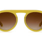 The Krewe Cameron Sunglasses showcase a trendy yellow round acetate frame with brown gradient lenses, providing excellent UVA and UVB protection against a simple white backdrop.