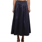A person wearing the Simkhai Elora Midi Skirt with a matching cropped top and black heeled sandals, standing against a white background.