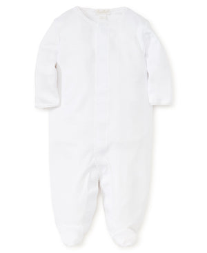 White Kissy Kissy Premier Basics Footie with long sleeves and enclosed feet, featuring a front zipper and a delicate trim around the neckline for easy changing.