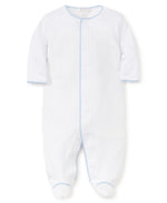 Kissy Kissy Premier Basics Footie with white baby footie onesie with blue stitching along the edges and a blue vertical line down the front, displayed on a white background.