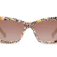 A pair of Krewe Brigitte Sunglasses with a cat-eye silhouette and tinted lenses, isolated on a white background.