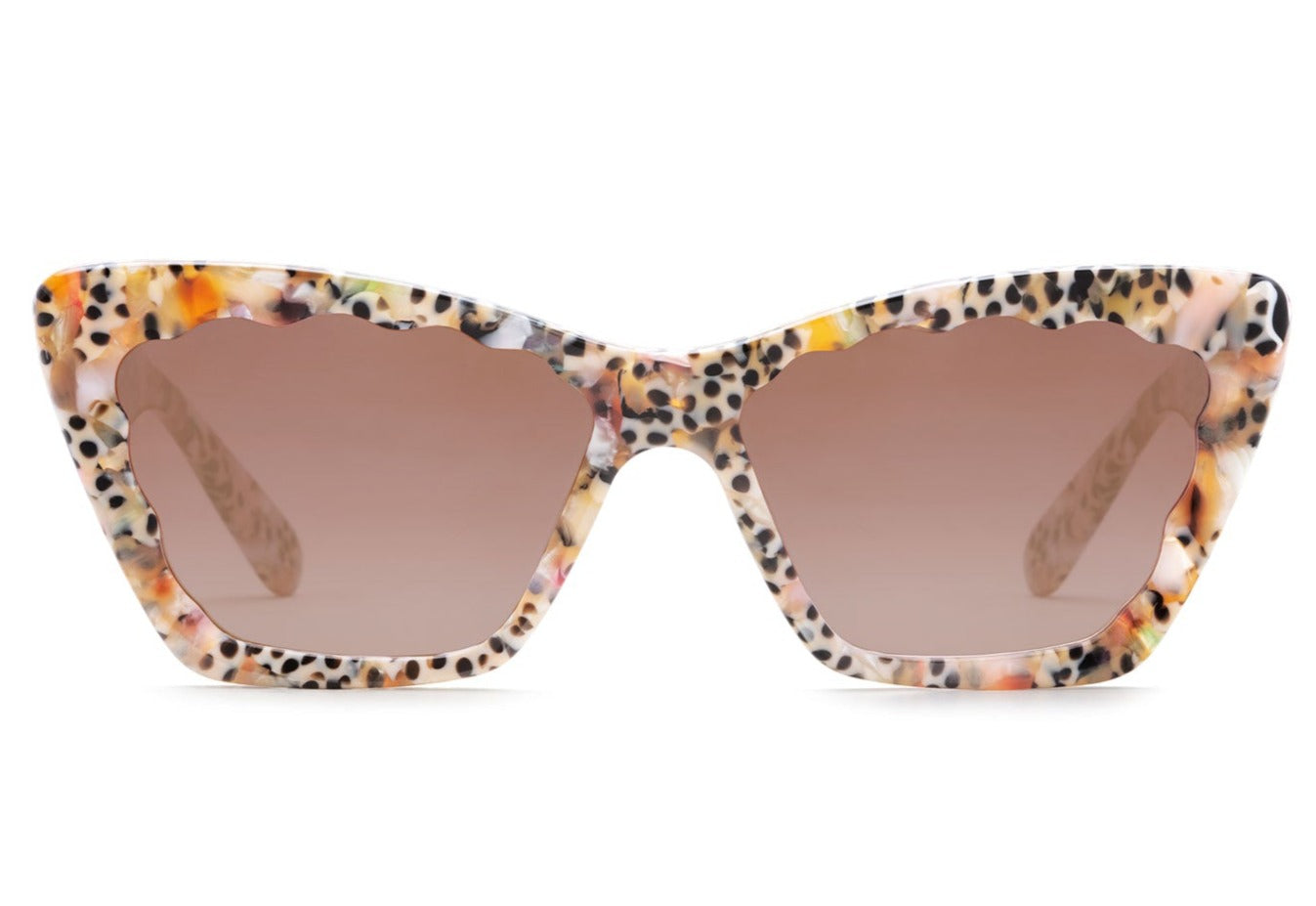 A pair of Krewe Brigitte Sunglasses with a cat-eye silhouette and tinted lenses, isolated on a white background.