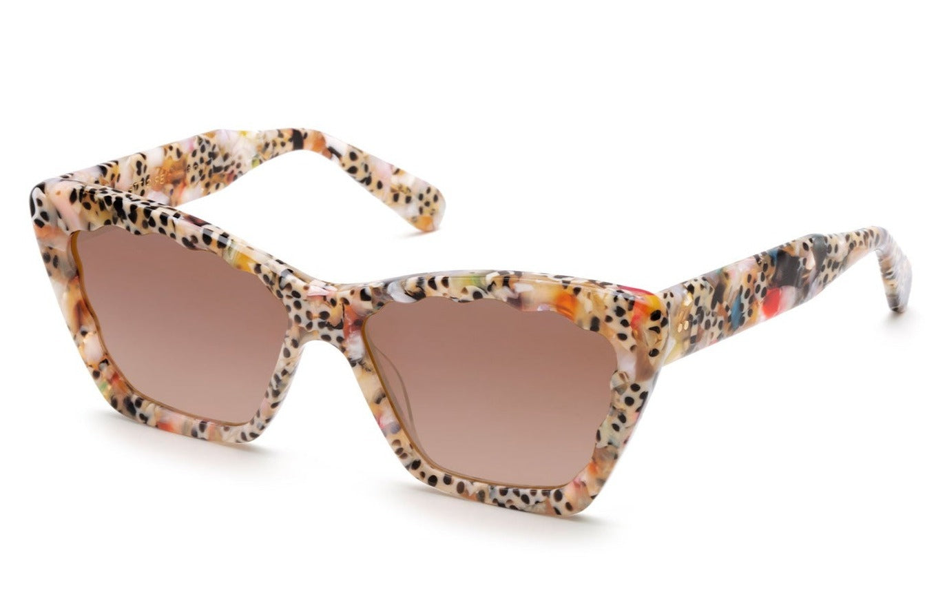 A pair of Krewe Brigitte sunglasses with patterned frames on a white background, offering 100% UVA / UVB protection.