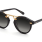 A pair of Krewe STL Nylon Sunglasses with gold accents, handcrafted for a stylish look.