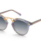 The Krewe St Louis Mirrored Sunglasses feature round luxury acetate frames with purple accents, gray-tinted gradient lenses, and 24K gold-plated detailing on the temples and bridge, offering complete UVA/UVB protection.