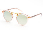 Krewe St Louis Mirrored Sunglasses featuring luxury acetate frames, round green-tinted lenses, 24K gold-plated hardware, and UVA/UVB protection, placed on a white background.