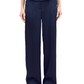 Person standing in stylish Simkhai Kyra Wide Leg Pant in Midnight and a matching top.