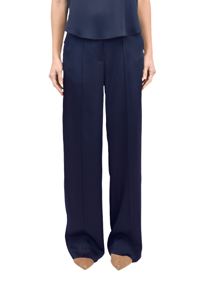 Person standing in stylish Simkhai Kyra Wide Leg Pant in Midnight and a matching top.