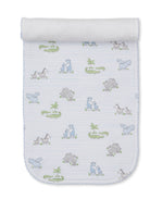The Safari Party Burp Cloth by Kissy Kissy is a white baby burp cloth crafted from soft Pima cotton, featuring a light blue stripe design and an adorable animal pattern with giraffes, hippos, zebras, crocodiles, and palm trees.