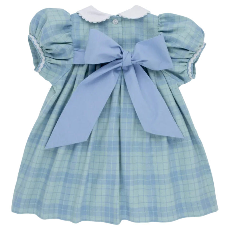 Light blue Audubon Park Plaid Baby Girls’ and Girls’ Mary Dal Dress by The Beaufort Bonnet Company, featuring short puffed sleeves, a white scalloped collar, and a large blue bow tied at the back—perfect for any special occasion.
