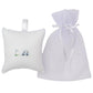 A Kissy Kissy Fairway Foursome Musical Pillow with golf embroidery is beside a tulle drawstring bag adorned with ribbon.