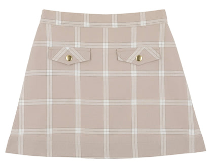 Girls’ Perrin Pocket Flannel Skirt by The Beaufort Bonnet Company, showcasing a beige A-line silhouette with a white Thompson Park Plaid pattern, two front flap pockets, and elegant gold button details.