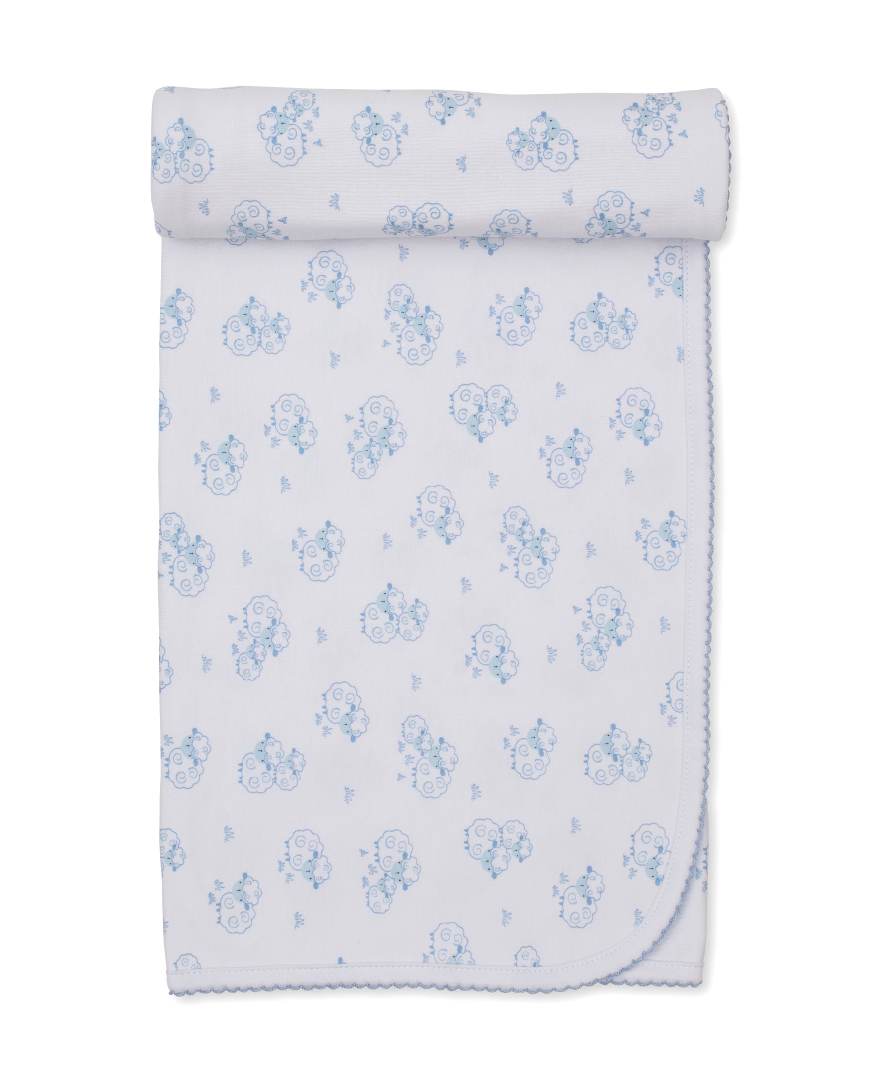 The Sweet Sheep Blanket by Kissy Kissy is a white baby blanket adorned with light blue cartoon animals and sheep, crafted from soft Pima cotton with scalloped edging and neatly rolled at one end.